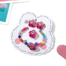 Set of children's “chosen” 3 subjects: clips, bracelet, ring, flowers and butterflies, colored