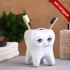 A glass under the toothbrush 