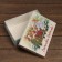 The box is folding, the lid is the "happy Christmas" 24 x 17 x 8 cm