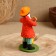 Dymkovo toy "Standing man with a chicken"