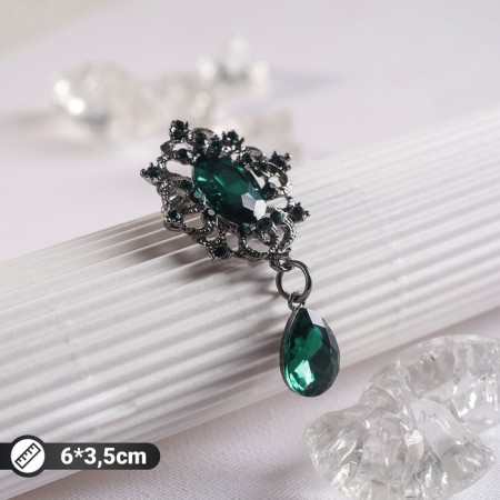 Brooch "Empress" of a monogram, emerald color in gray metal