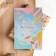 A postcard with a wooden element "Dream!"