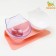 Plastic bowls on a pink stand are 27.5 x 14 x 15 cm transparent/white
