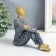 Souvenir Polystone "A young man in a gray sweater, sits" 14.5x7x14 cm