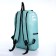 A backpack with a zipper, an outer pocket, 2 side pockets, a turquoise color