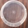 A plastic single can with a white handle, 155 ml, d = 6.9 cm, without a lid, the color is transparent