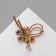 Brooch "Cinter" with bead and flowers, white color in gold