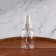 A bottle for storage, with a spray, with a division scale, 50 ml, white/transparent color