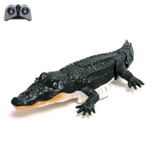 The radio -controlled crocodile, floats, works from the battery, the color is green