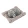 Toy on a car panel, a dog on a pillow, gray color