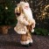 Santa Claus "in a fluffy fur coat, cap, with a gift" 47 cm, white-golden