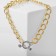 The necklace "chain" cloves with rhinestones, white color in golden-silver, l = 42 cm