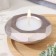 Candle "Complete" in a candlestick with faces of gypsum large, 10.5x3cm, champagne