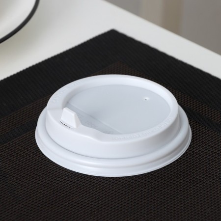 A plastic disposable lid for a white glass, with a valve, d = 9 cm-1