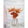 Flower composition "Eucalypt" in a bottle vase, orange / transparent color