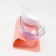 Plastic bowls on a pink stand are 27.5 x 14 x 15 cm transparent/white