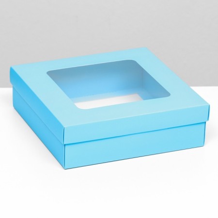 The box is folding, cover is, turquoise, with a window of 20 x 20 x 6 cm