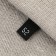 Textile strip “52”, 4.6 x 1.1 cm, black color