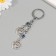 Keychain from the evil eye Metal "two suns" 9 cm