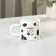 Ceramic mug with a Milk lid and tube, 350 ml, white and black color