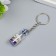 Plastic keychain "Shell and pearl in the bottle" Blue 3.6x1.6x1.6 cm