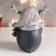 Polystone souvenir "Penguin in a scarf and cap with horns, with a gift" Mix 15.5x13x9 cm