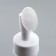 A bottle with a brush for washing, with a dispenser, 150 ml, white/transparent color