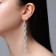 Hanging earrings with Hollywood rhinestones, white color in silver, 10.5 cm