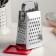 A heap with a doser lid and a side for cheese, a metal pen, color mix