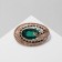 Eye brooch, emerald color in gold