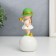 Souvenir Polystone "Baby in a green hat, with a gold bubble on the ball" 16x7x7 cm