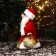 Santa Claus "with a decorated staff and bag" moves, with backlight, 30x16 cm, red