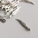 Pendant "feather" Color silver 0.3x1.5 cm