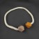 Picked up for curtains "pebbles", d = 3 × 46 cm, mustard/powder color