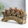 Polystone souvenir "Five elephants on a tusk with flowers" Bronze 20.5x4x11 cm