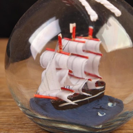 The ship is souvenir "only forward", in a bottle, vertical. 11*8cm-1