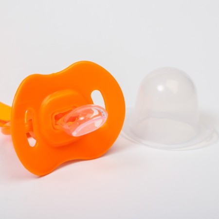 Silicone orthodontic dummy with a holder and cap, from 0 months, color orange-3