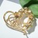 Brooch "Heart" with pearls, white color in gold