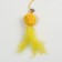 Domesticon-pound with a soft ball and feathers, yellow