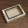 The box is folding, the lid is, with the “Bunning of the Rowan” window 30 x 20 x 9 cm