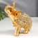 Souvenir Polystone "The Golden Elephant in the rich Popon" 11x5x9 cm