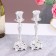 A set of 2 candlesticks, 7 x 7 x 19 cm