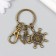 Keychain metal with carbine "anchor and storm" bronze 7 cm