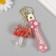 A keychain plastic with a carbine, a strap "Umbrella with a strawberry" Water with a decor 6x5x2 cm