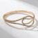 Bracelet with rhinestones "ice" waves, white color in gold