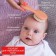 Soft comb, a comb and a scallop with a pile of sheep's wool, peach color