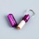 The addressee for investing is wide, capsule 5.2x1.4 cm, fuchsia color