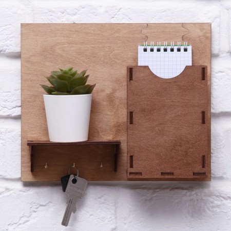 The keywood is wall -mounted with the pocket shelf.