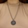 Kolovrat pendant-cooler is glowing, the color is black silver, 60 cm