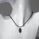 Kulons "Uzolnutini" on the magnet, halves of the heart, black-silver color, 48 cm